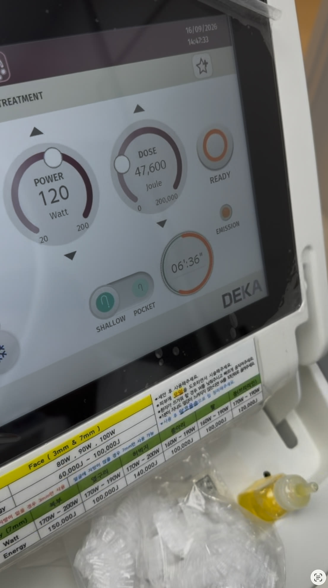 The Onda console screen during a session at Tune Clinic, showing power, delivered energy and the treatment timer