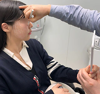 Physician refining secondary facial treatment zones