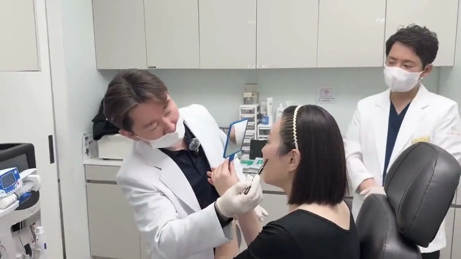 A Tune Clinic physician reviewing facial proportions with a patient